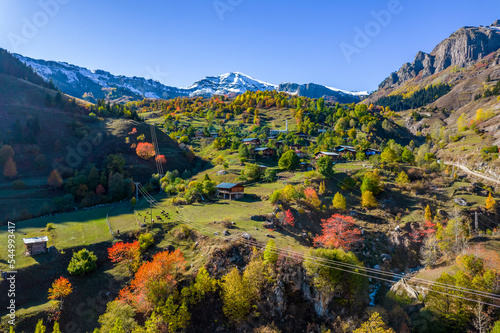 Autumn view in Savsat. Artvin, Turkey. Beautiful autumn landscape with colorful trees. Bazgiret Maden Village. Aerial drone shot. photo