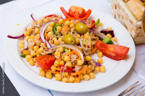 Spanish cuisine - salad with garbanzos and olives. High quality photo