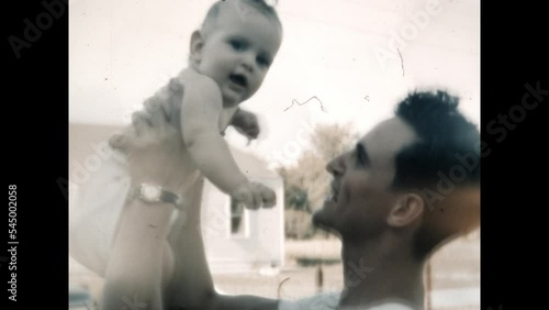 Father and Baby 1951 - A father holds his baby in Chicago, Illinois in 1951. 