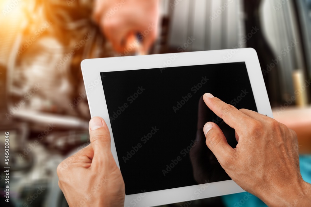 Mechanic worker with digital tablet on car background Mechanic worker with digital tablet on car background