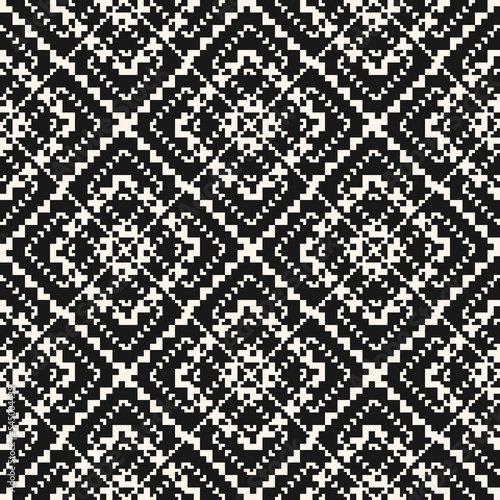 Vector geometric traditional folk ornament. Modern ethnic style seamless pattern. Ornamental geo background with small squares, snowflakes, floral shapes. Monochrome texture of embroidery, knitting