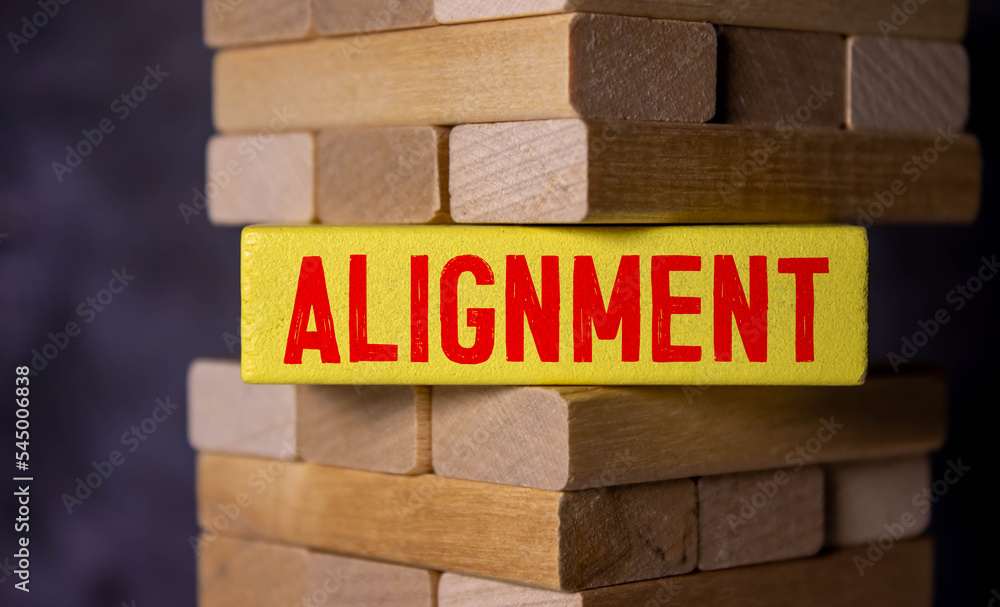 alignment on wooden block and various business papers on brown background - obrazy, fototapety, plakaty 