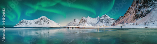 Fabulous winter scenery on Skagsanden beach at night with Northern lights.