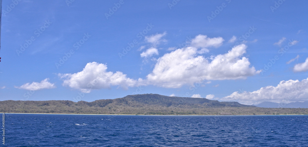 Tropical Island view in the sea and blue sky Tropical Island view in the sea and blue sky