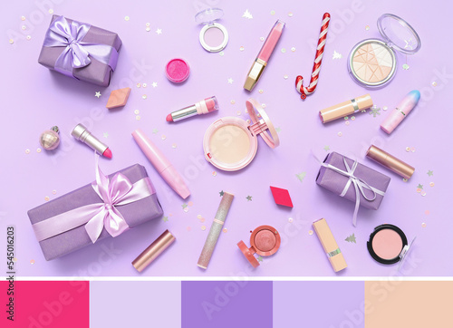 Makeup products with Christmas gifts on lilac background. Different color patterns