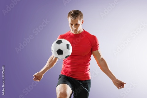 Young happy fan man with football ball