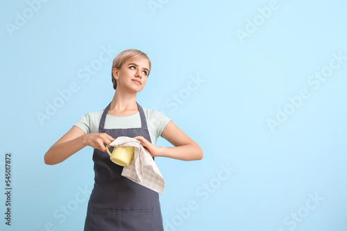 Female barista with cup and...