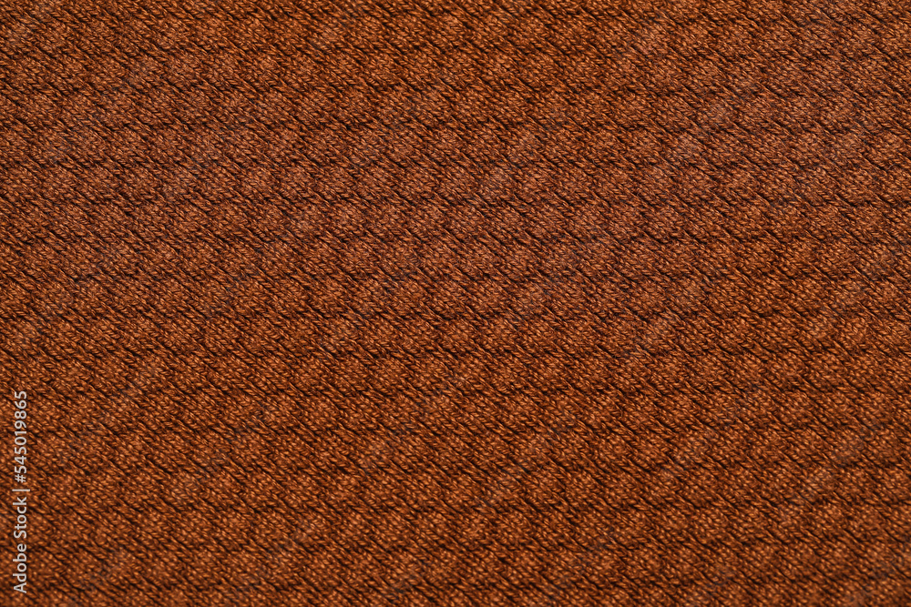 Fototapeta premium Closeup view of brown fabric with pattern as background