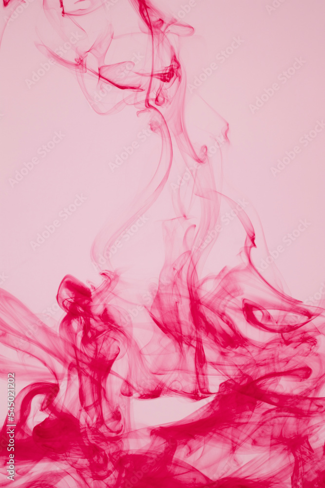 Fototapeta premium red ink dissolving in water