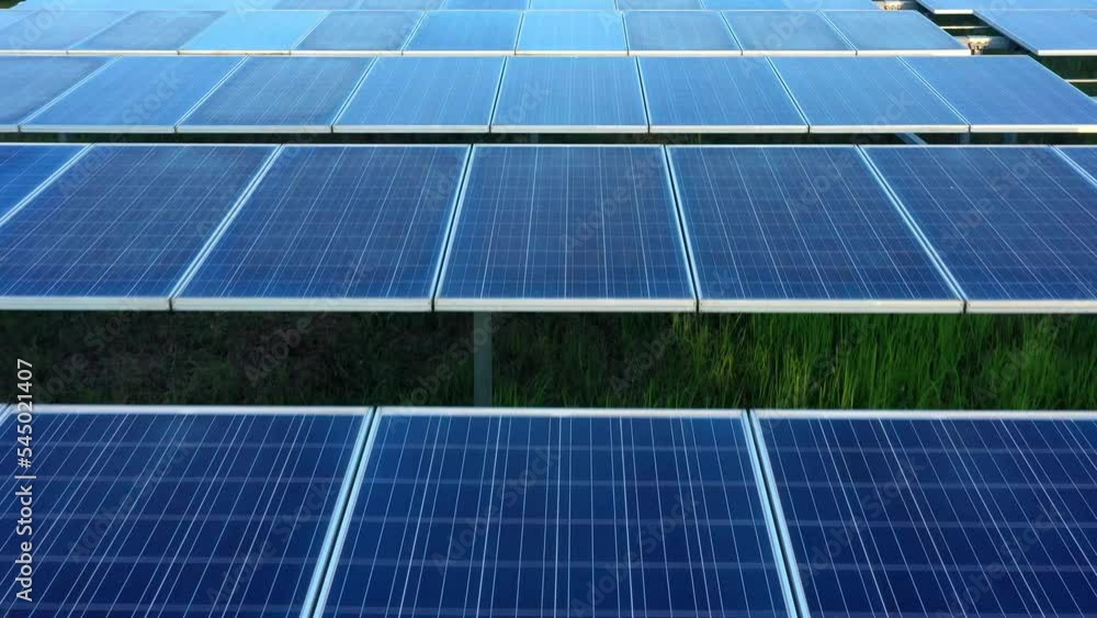 Aerial view from drone flying over solar panels stand in row, green energy landscape electrical power ecology innovation nature environment Aerial view from drone flying over solar panels stand in row, green energy landscape electrical power ecology innovation nature environment