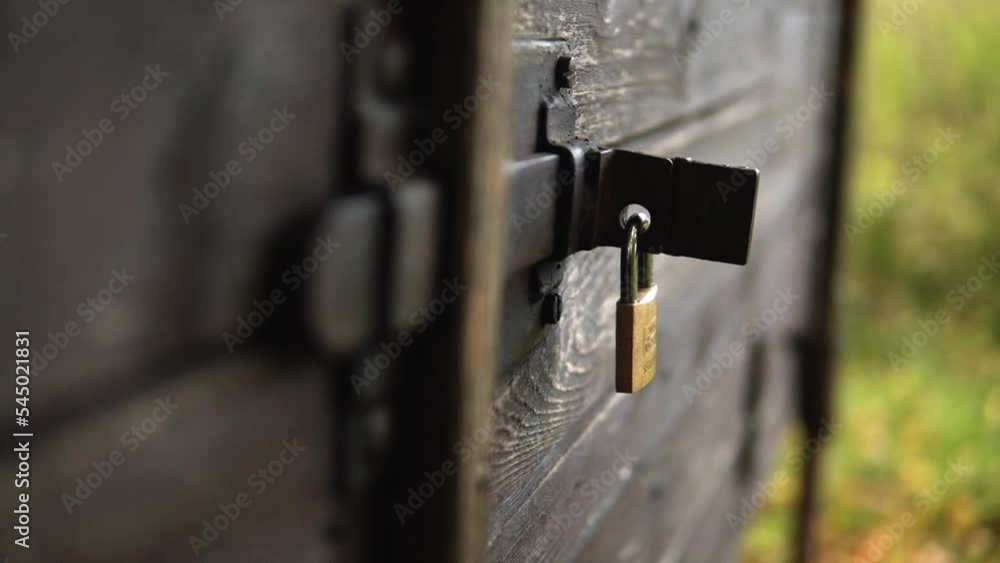 Wooden cabin locked with a lock that was just closed. Wooden cabin locked with a lock that was just closed.