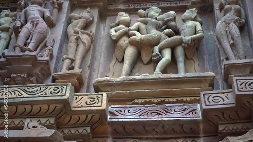Famous Erotic Arts On The Wall of Khajuraho Temples In Chhatarpur, Madhya Pradesh, India. - tilt up photo