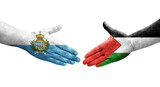 Handshake between Palestine and San Marino flags painted on hands, isolated transparent image.