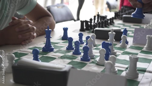 Close up in chess tournament of young players photo