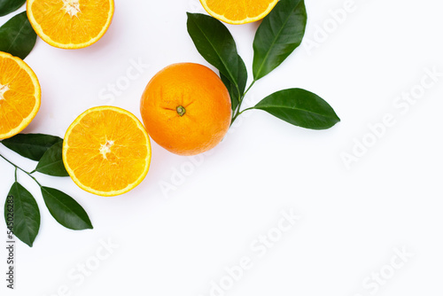 Orange fruit with green leaves on white background.