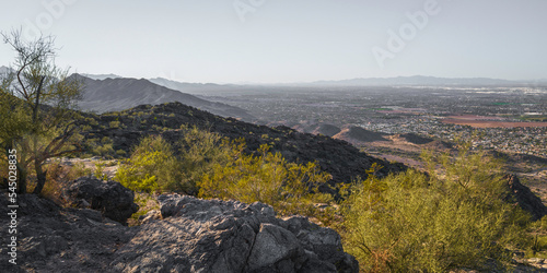 Haze over the desert mountain hills in South Mountain and Preserve Public Park in Phoenix, Arizona at sunset