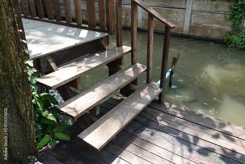 3-step wooden stairs in the house or park.
A walkway up and down in the garden.