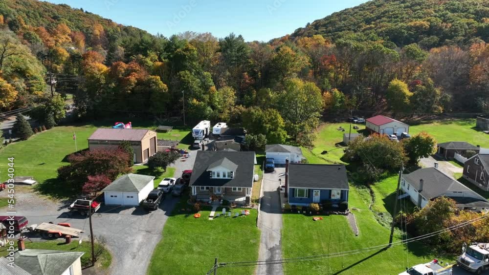 Rural American homes and flag in Appalachian mountain coal mining town