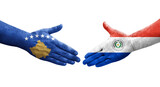 Handshake between Paraguay and Kosovo flags painted on hands, isolated transparent image.