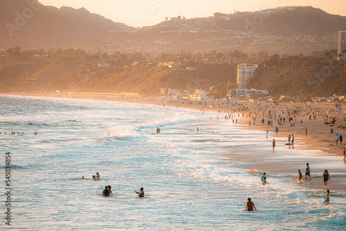 people walking on the beach