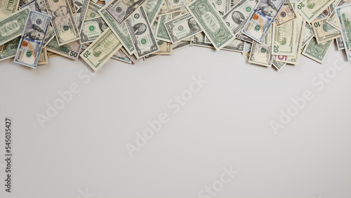 Mixed Denomination Bills Border on White Surface. Prosperity Background with copy-space.