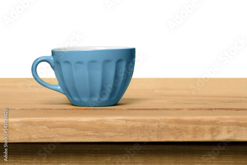 Blue cup of coffee on table isolated on white background