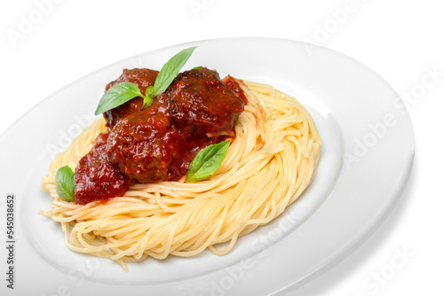 Spaghetti pasta with tomatoes and basil on plate