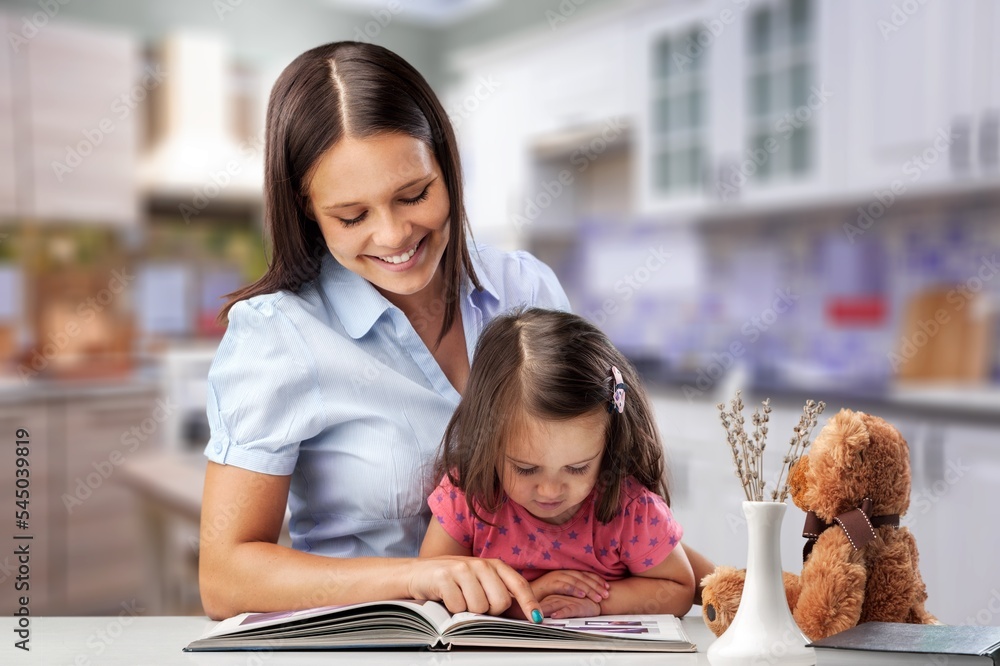 Obraz premium Mother and child study together at home