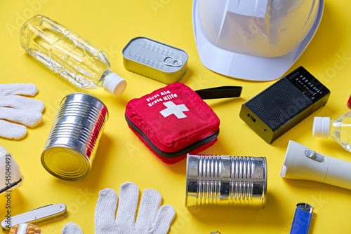 Disaster preparedness kit on yellow background.	 photo