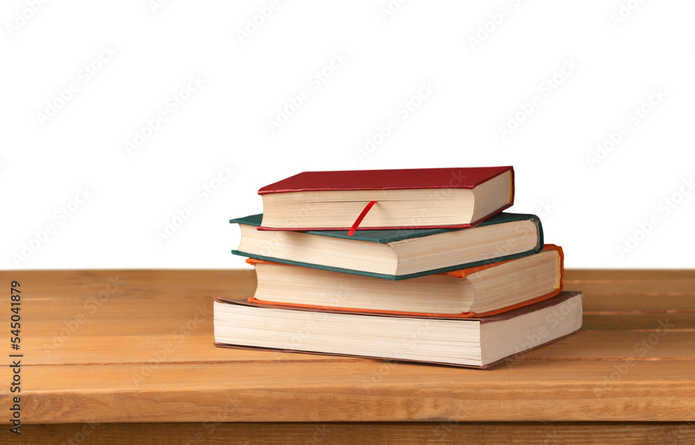 Stack of books on table isolated on white background Stack of books on table isolated on white background