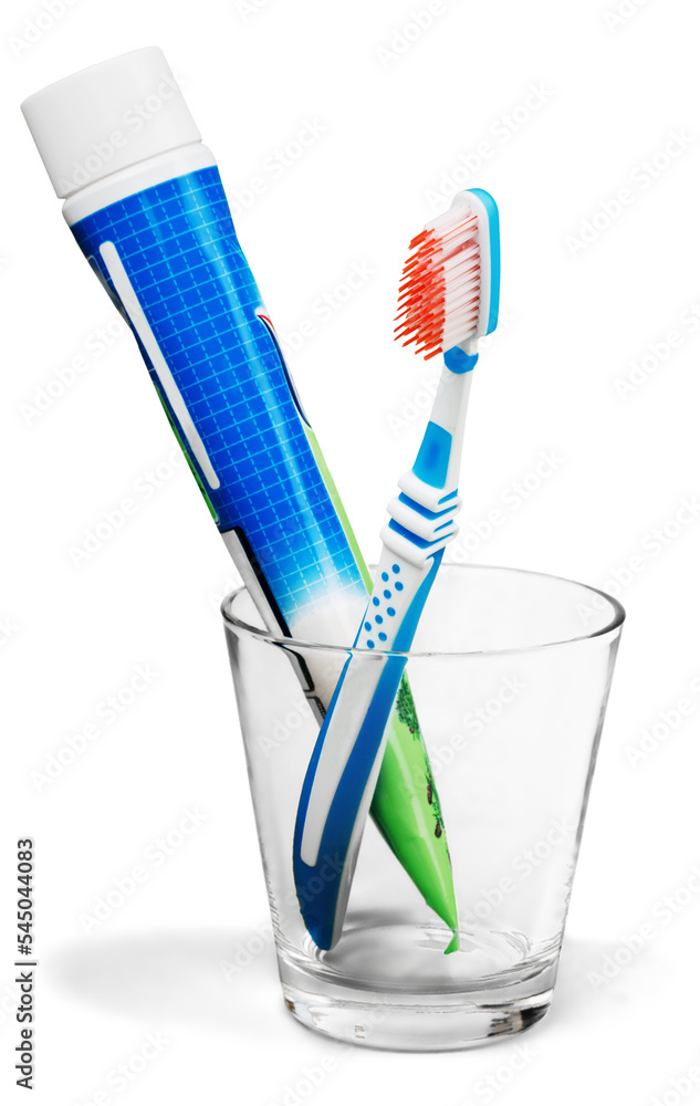 Toothbrush and Toothpaste Tube in a Glass Toothbrush and Toothpaste Tube in a Glass