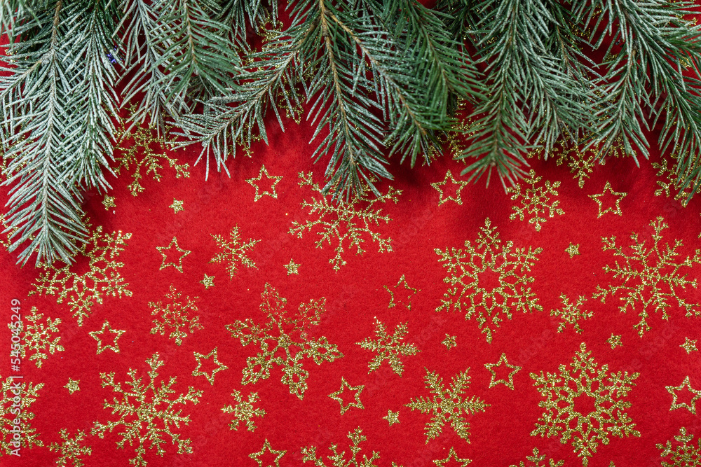 Christmas pine branches on the table. Christmas background with a Christmas tree. Merry Christmas greeting card, frame, banner. Space for text. Selective focus. Selective focus. 