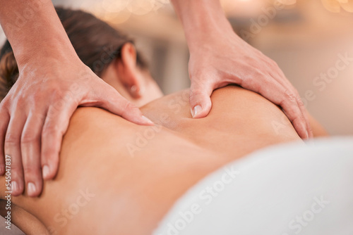 Spa, relax and massage with back of woman for beauty, skincare and wellness therapy. Peace, health and luxury with hands of therapist and customer for salon, muscle and physiotherapy body care