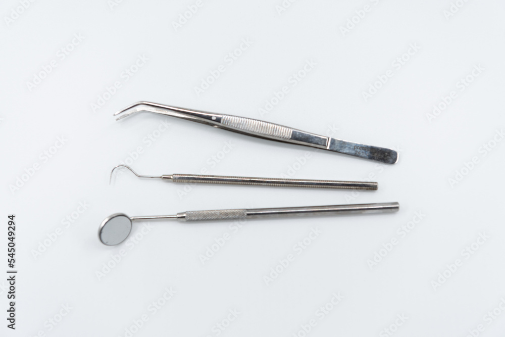Professional dental instruments on white background Professional dental instruments on white background