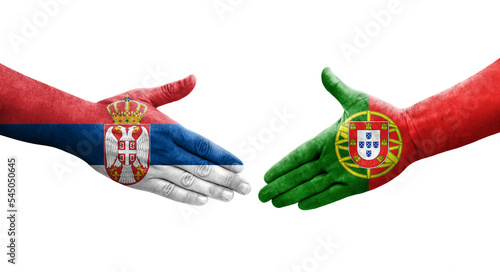 Handshake between Portugal and Serbia flags painted on hands  isolated transparent image.