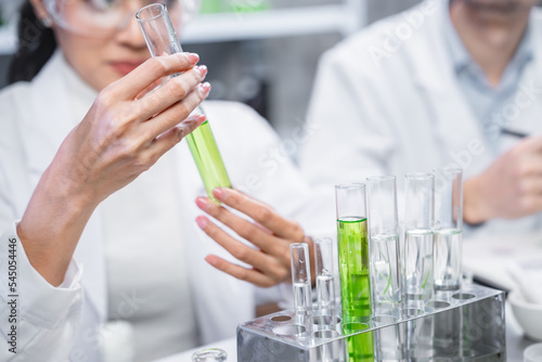 pharmaceutical science laboratory of health care cosmetic research, apothecary scientist working to test a organic herb drug of chemical medicine experiment with chemist doctor, beaker glasses tools