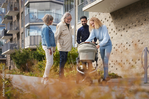 People in front of block of flats photo