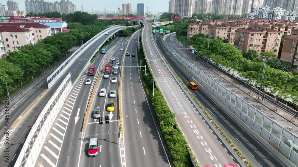 Drone flying over the highway in the city. Drone aerial view. Modern highway conjunction in Shanghai China. Transportation, cityscape and business concept b-roll footage. Drone flying over the highway in the city. Drone aerial view. Modern highway conjunction in Shanghai China. Transportation, cityscape and business concept b-roll footage.