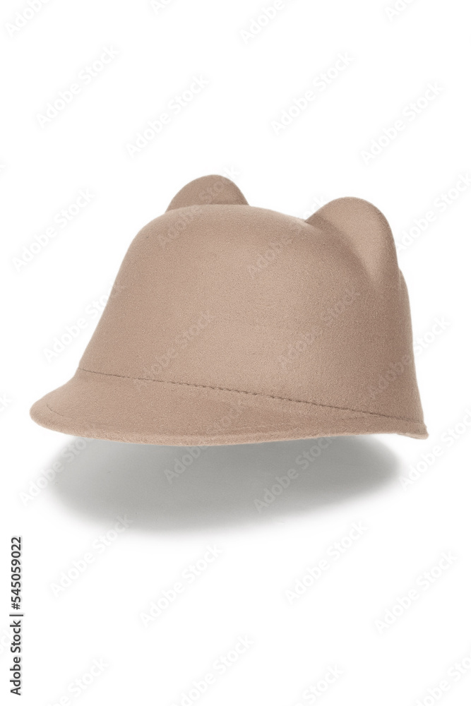 Close-up shot of a beige felt jockey hat with ears. The casual jockey felt hat with ears is isolated on a white background. Side view. Close-up shot of a beige felt jockey hat with ears. The casual jockey felt hat with ears is isolated on a white background. Side view.