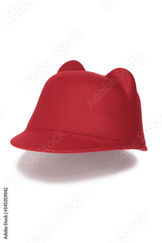 Close-up shot of a red felt jockey hat with ears. The casual jockey felt hat with ears is isolated on a white background. Side view.