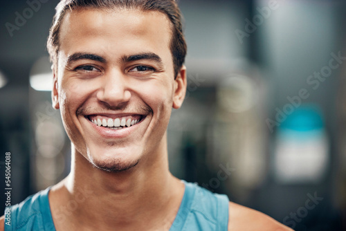 Portrait, gym and sports man with smile for wellness, fitness and healthy lifestyle, wellness with motivation, commitment and our vision. Face of an athlete with workout, exercise or training mission
