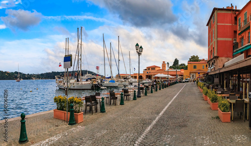 Seaside promenade with colorful traditional houses along the Mediterranean Sea in Villefranche sur Mer Old Town on the French Riviera, South of France