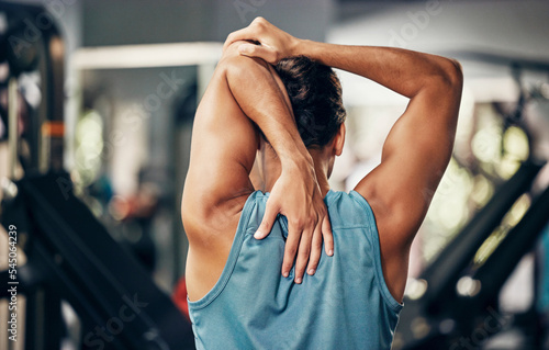Photography Fitness, man and stretching back in gym for health, wellness and flexibility