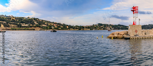 фотографія Lighthouse and luxury boats in the bay on the Mediterranean Sea in Villefranche