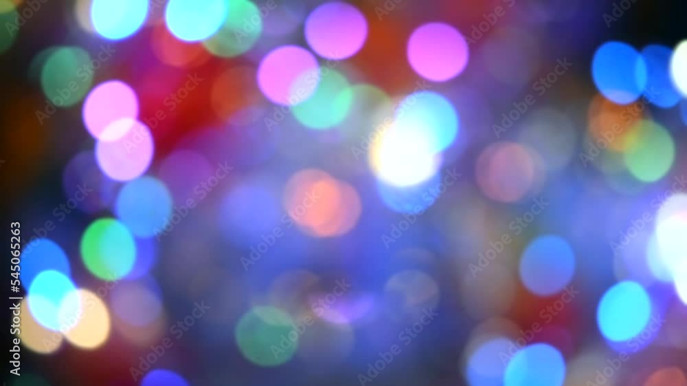 Festive flashing abstract background. Blurred texture background with round bokeh spots. Multicolored blinks background. Celebration New Year Christmas Birthday party holiday Flickering illumination Festive flashing abstract background. Blurred texture background with round bokeh spots. Multicolored blinks background. Celebration New Year Christmas Birthday party holiday Flickering illumination