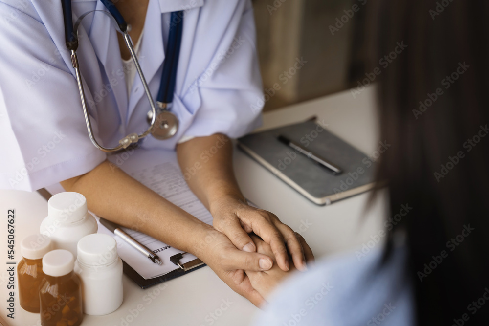 Young female therapist consulting male patient about pills. Doctor prescribing medicine sitting at the desk.