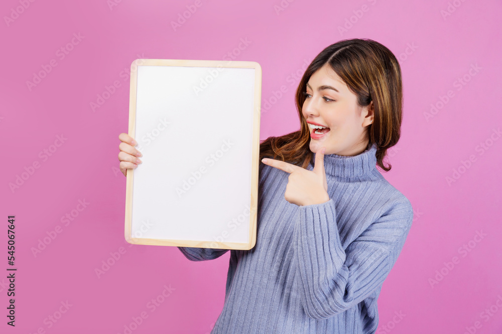 Portrait of Happy young woman holding an empty white placard over isolated pink background. Portrait of Happy young woman holding an empty white placard over isolated pink background.