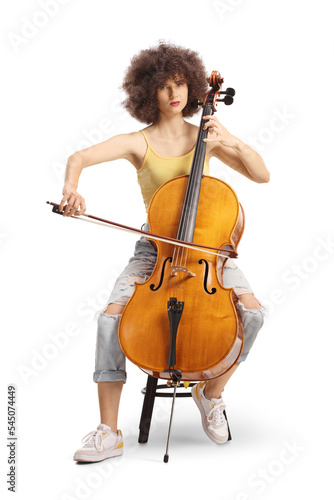 Female artist sitting and playing a cello