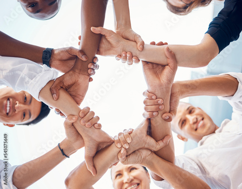 Team, hands and employee support for team building motivation on mission goals. Diversity, business teamwork and holding hands for success or trust collaboration in corporate startup community
