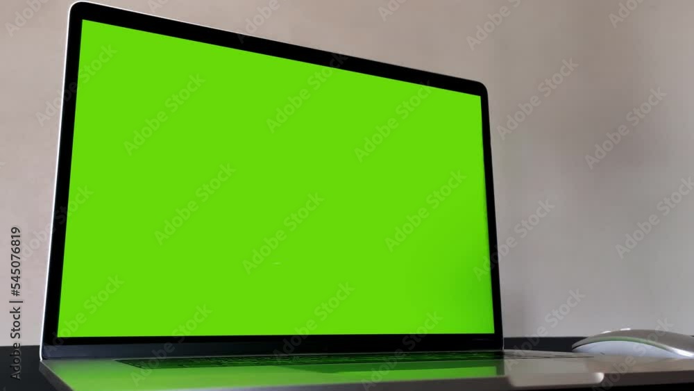 Laptop computer showing green chroma key screen stands. Chroma key stands on a white background, isolate. Laptop computer showing green chroma key screen stands. Chroma key stands on a white background, isolate.